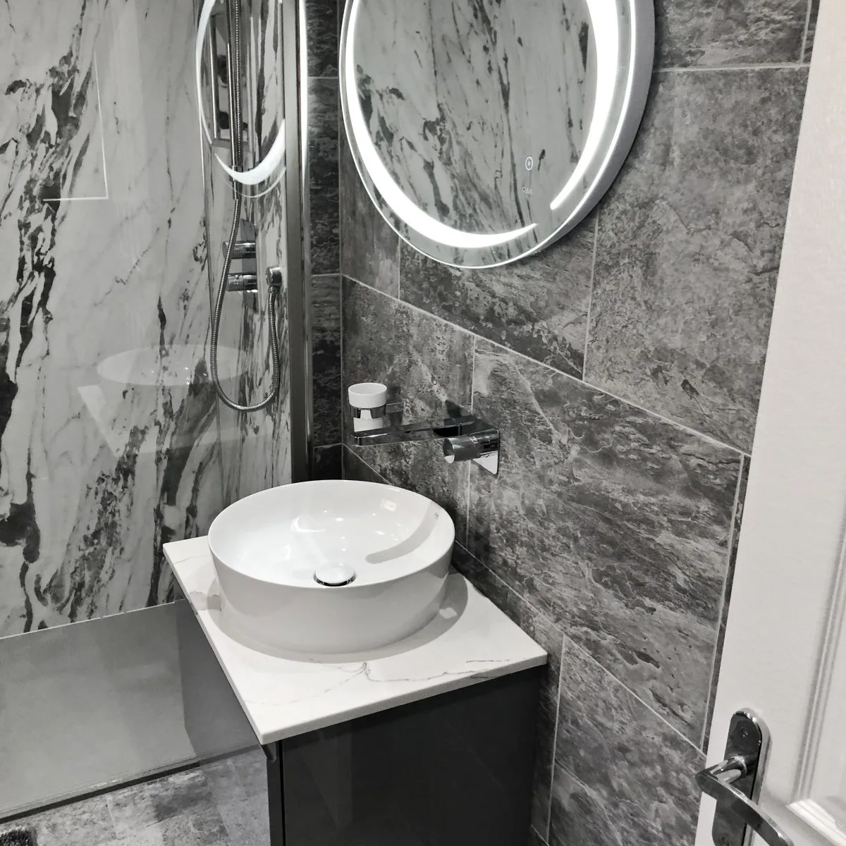 Rak shower room with Lightening Marble finish Showerwall